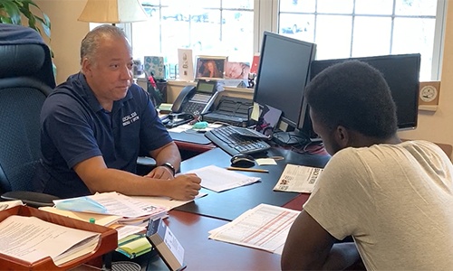 Executive Vice President Neil E. Gonzalvo speaking to a member